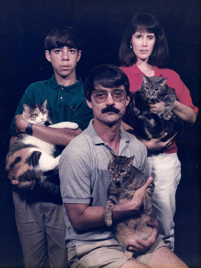 The World’s Greatest Photos of Men Posing With Cats