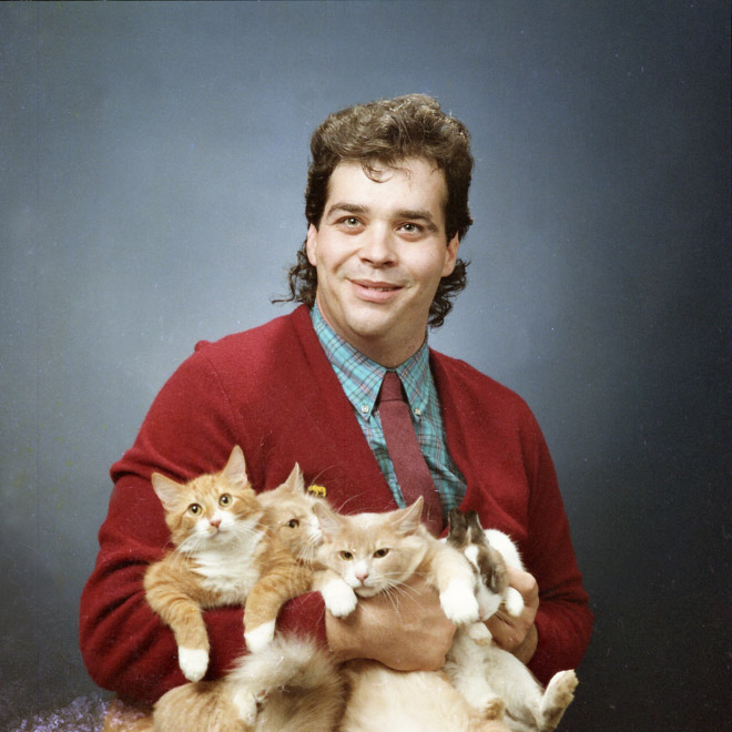 The World’s Greatest Photos of Men Posing With Cats