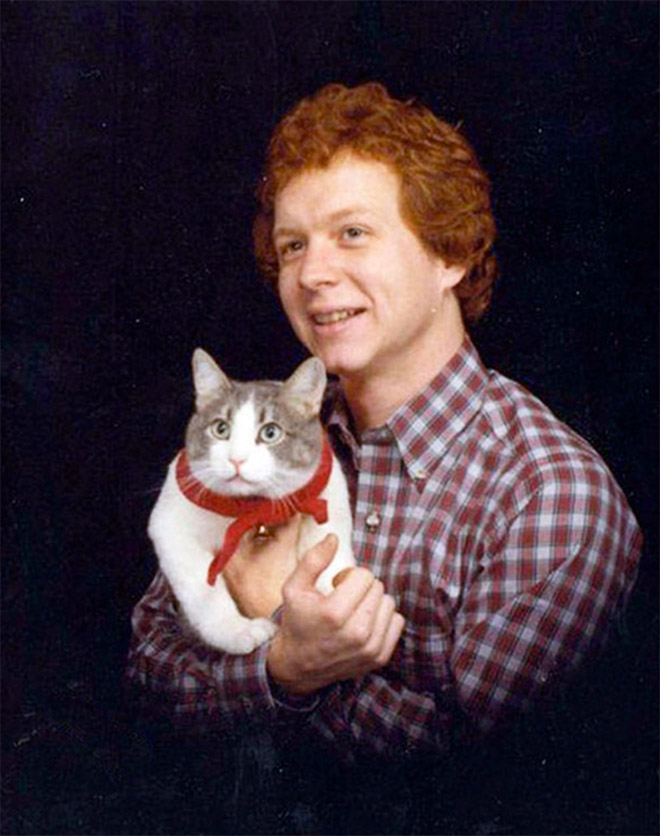 The World’s Greatest Photos of Men Posing With Cats