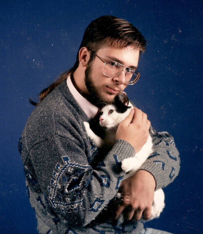 The World’s Greatest Photos of Men Posing With Cats