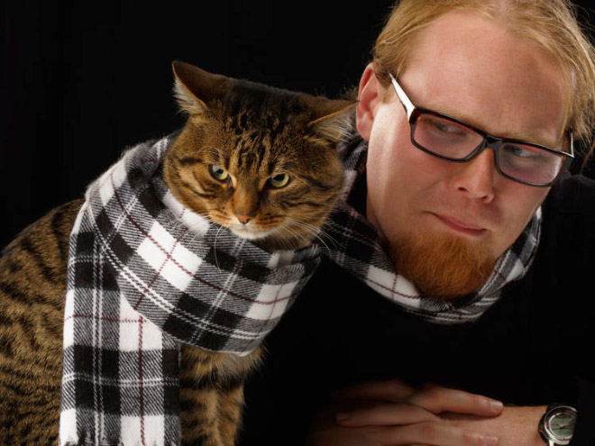 The World’s Greatest Photos of Men Posing With Cats