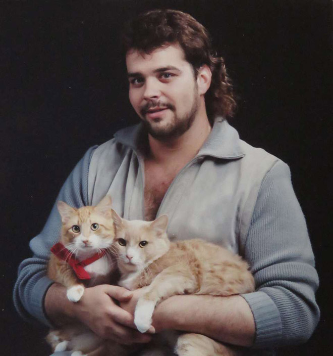 The World’s Greatest Photos of Men Posing With Cats