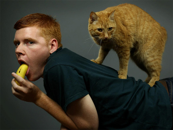 The World’s Greatest Photos of Men Posing With Cats