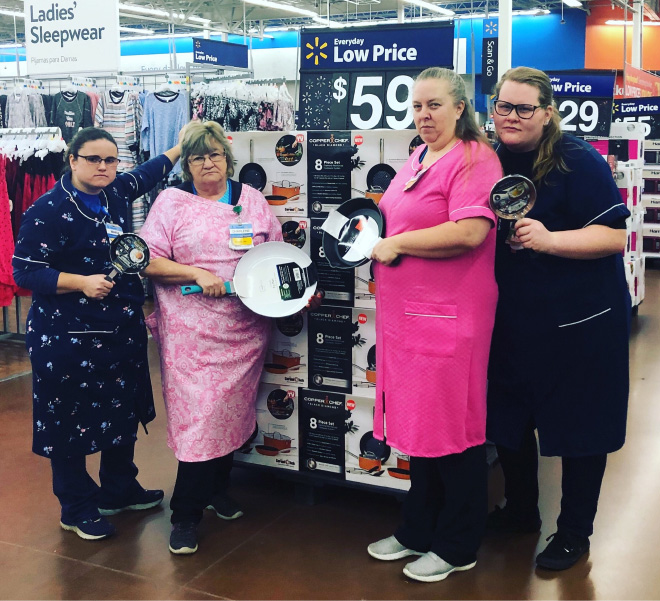 Walmart Keeps Posting Pictures of This Employee Posing With Stuff, She Goes Viral